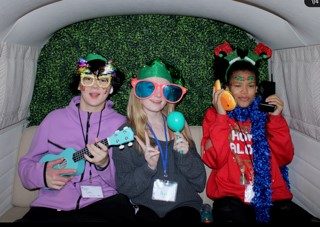 girls posing in photo booth