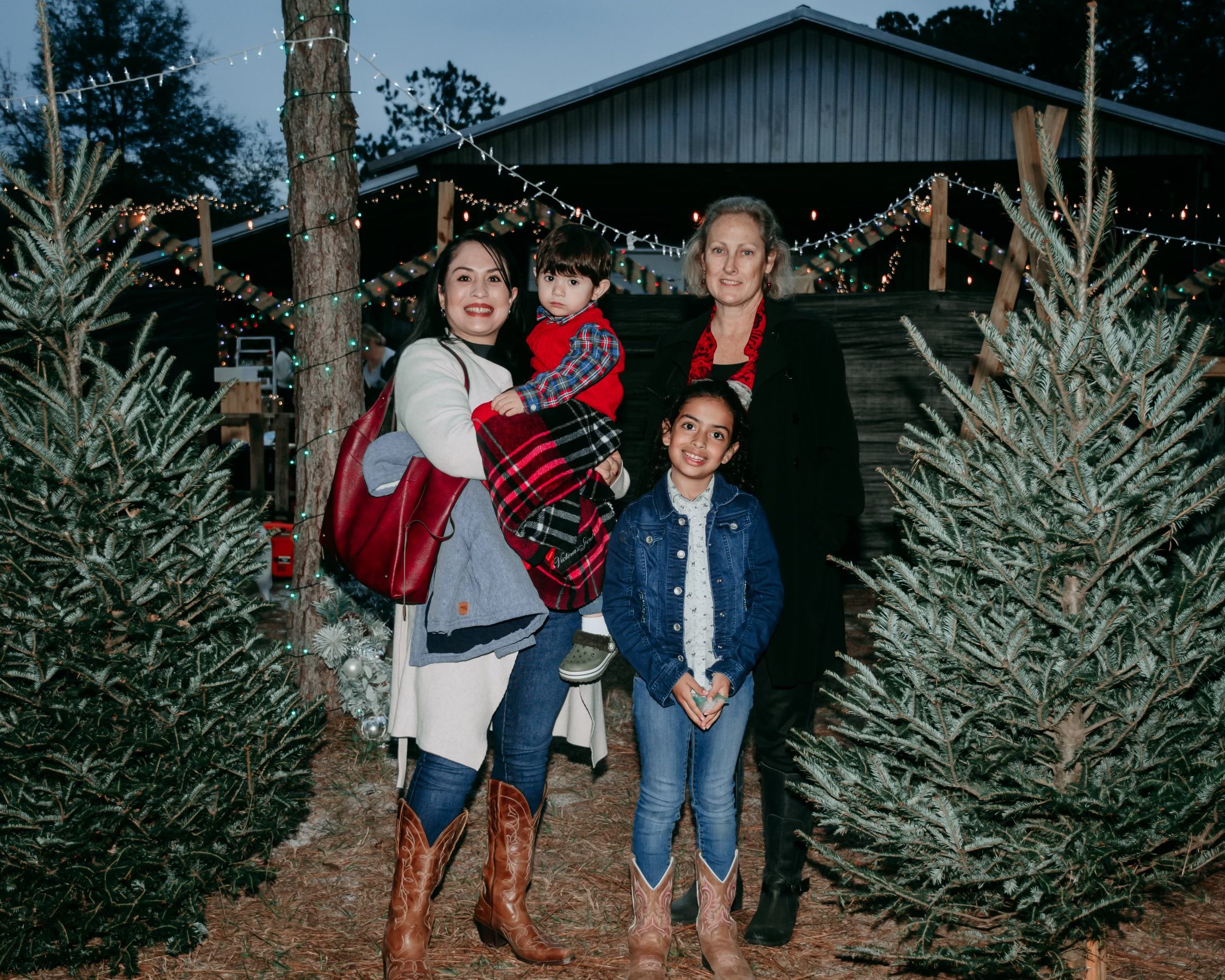 Family posing with trees