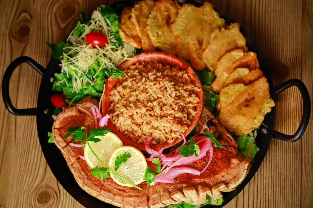 Dish Chuleta Kan Kan sale con arroz del dia from El Pegao restaurant