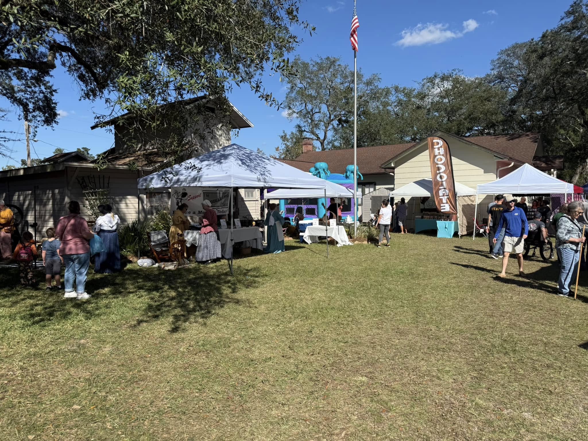 Outside of the Middleburg Museum pictured a bounce house and vendor tents with people walking around