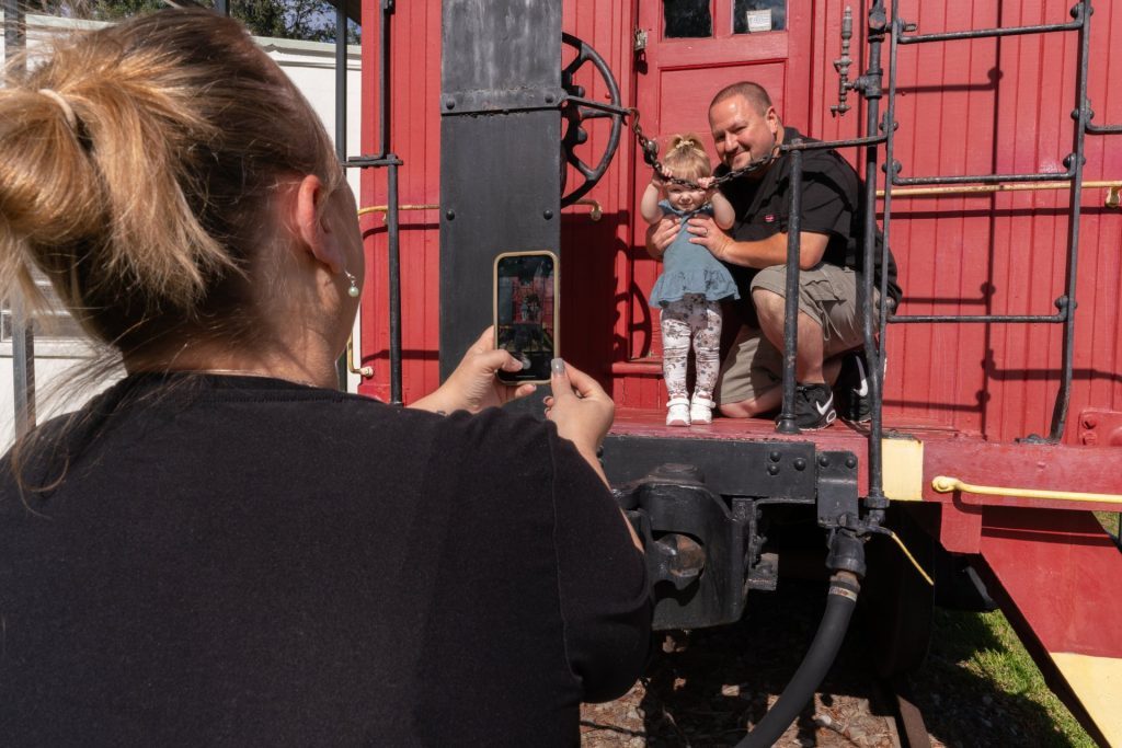 Family taking photo at Clay County Historic Triangle