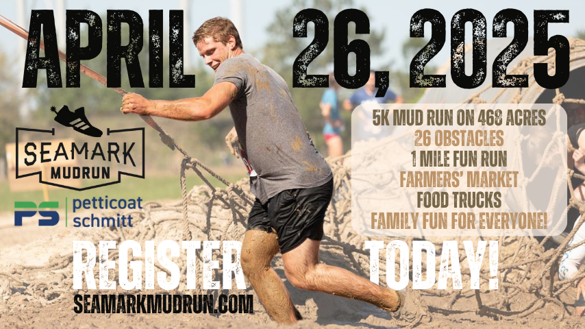 Man running through outdoor obstacle course with event information printed.