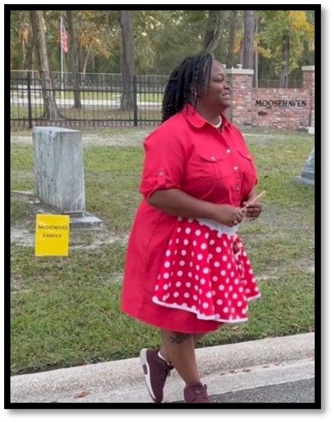 Photo of a woman giving a history tour.