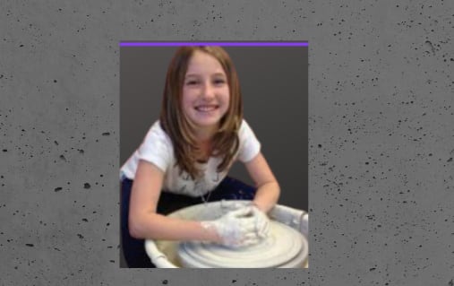 Photo of a girl using a pottery wheel.