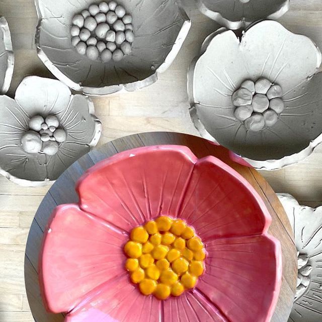 Photo of hand made clay flowers, one painted pink.