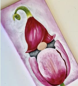 Photo of a painting of a pink tulip with a gnome peeking out.